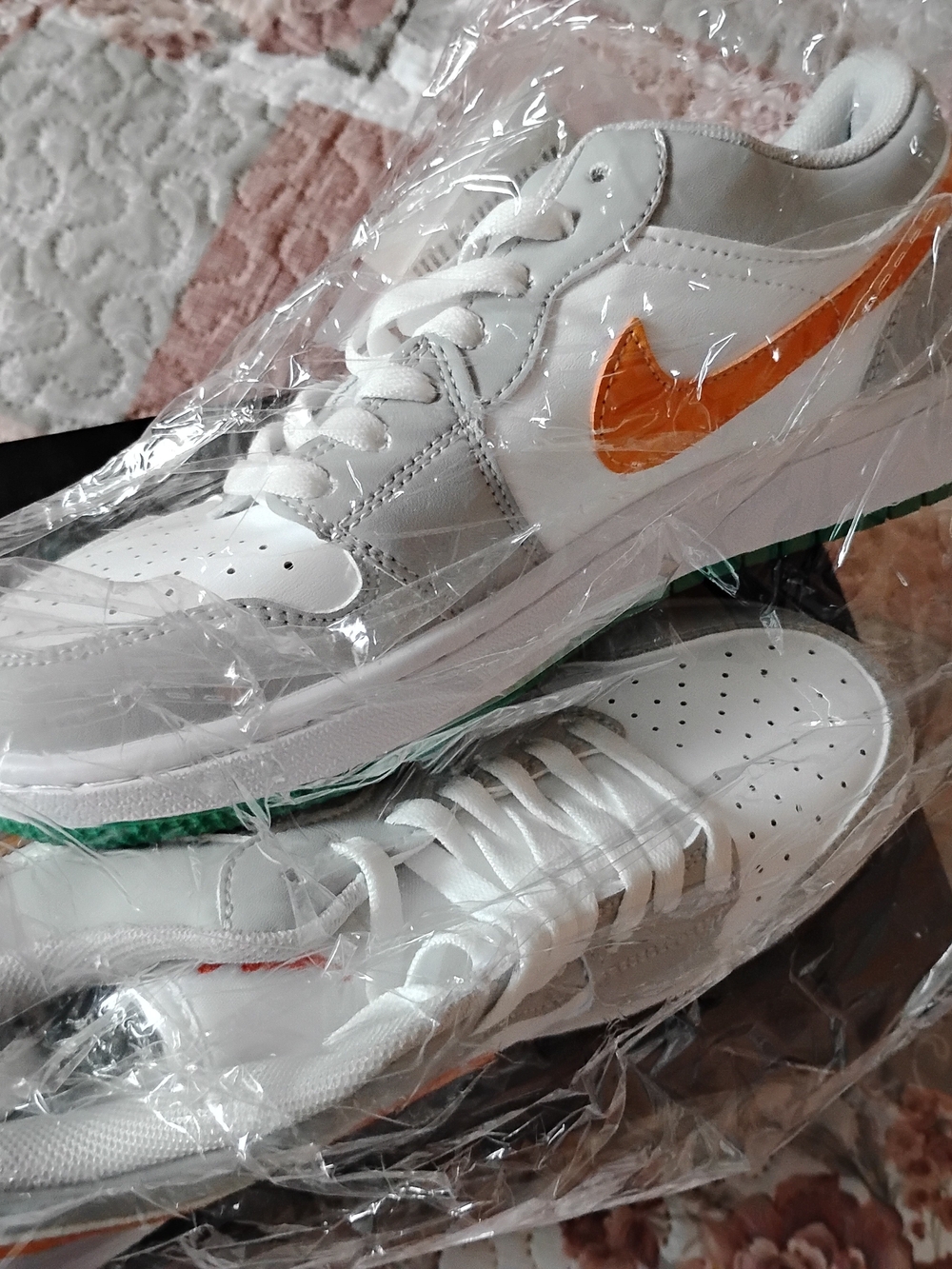 Nike White Low-Top Sneakers with Orange Swoosh and Green Trim